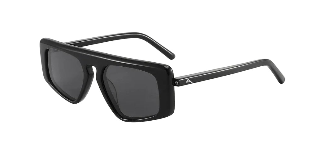 Black sunglasses with a brand logo on a light wooden surface