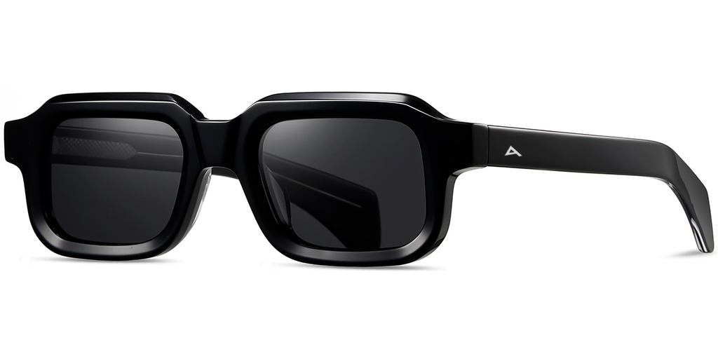 Black sunglasses with green lenses on a white background