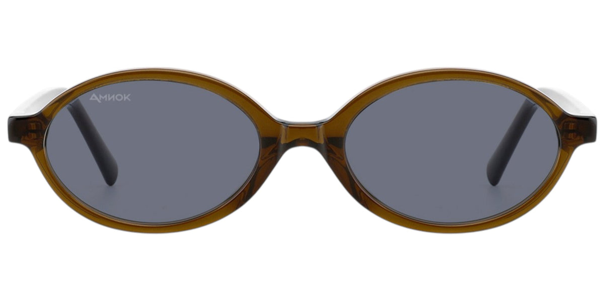 Oval sunglasses with a translucent amber-brown acetate frame and dark gray lenses, shown from the front on a white background.