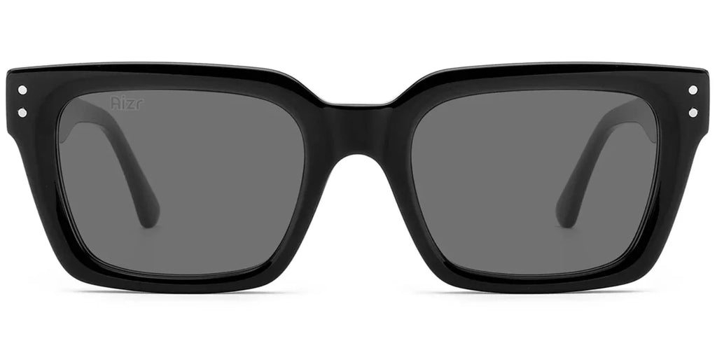 Black sunglasses with dark lenses on a white background
