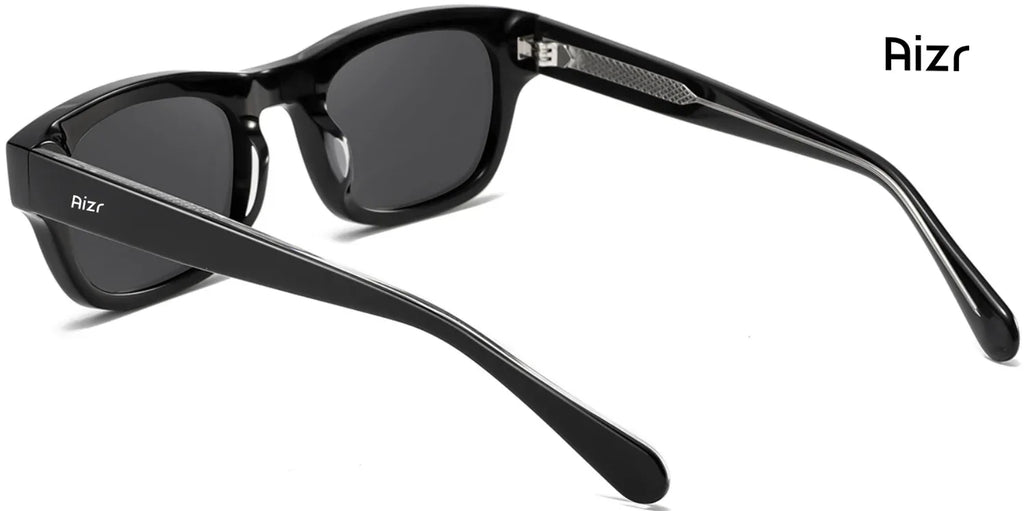Black sunglasses with 'Aizr' branding on a white background