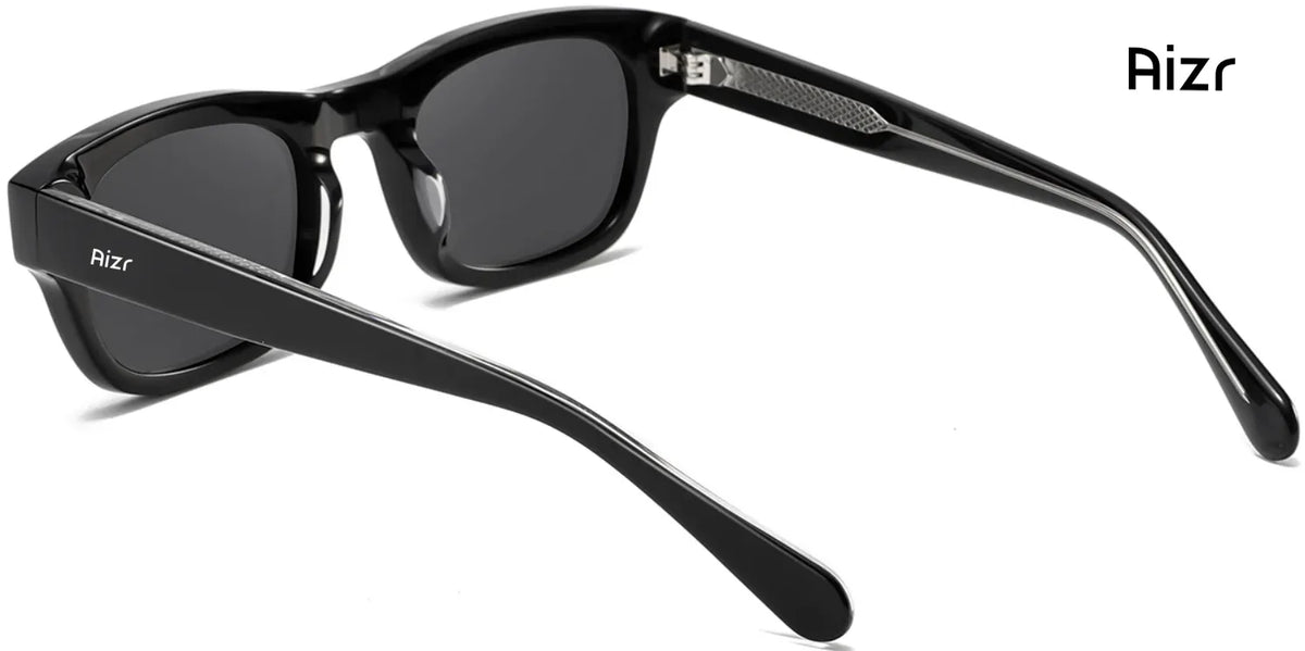 Black sunglasses with 'Aizr' branding on a white background