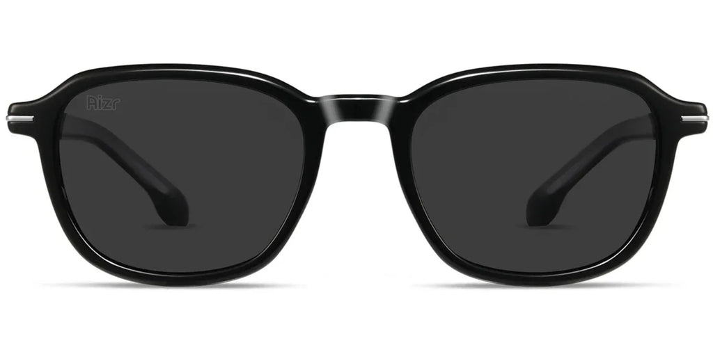 Black sunglasses with dark lenses on a white background