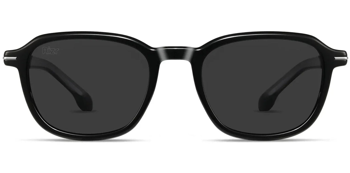 Black sunglasses with dark lenses on a white background