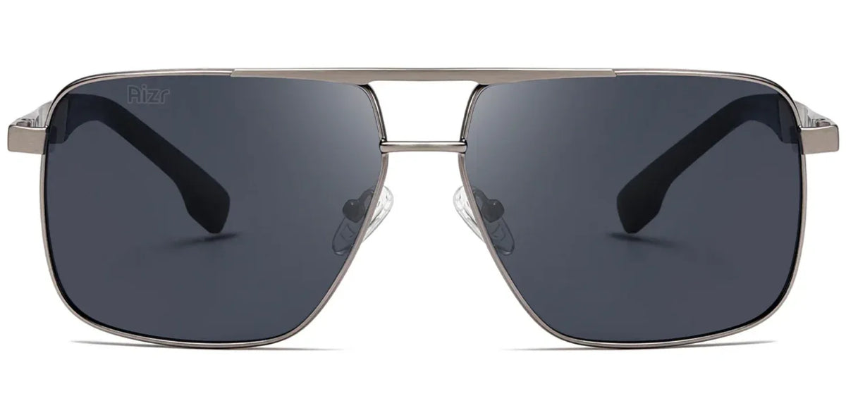 Aviator sunglasses with dark lenses and silver frame on a white background