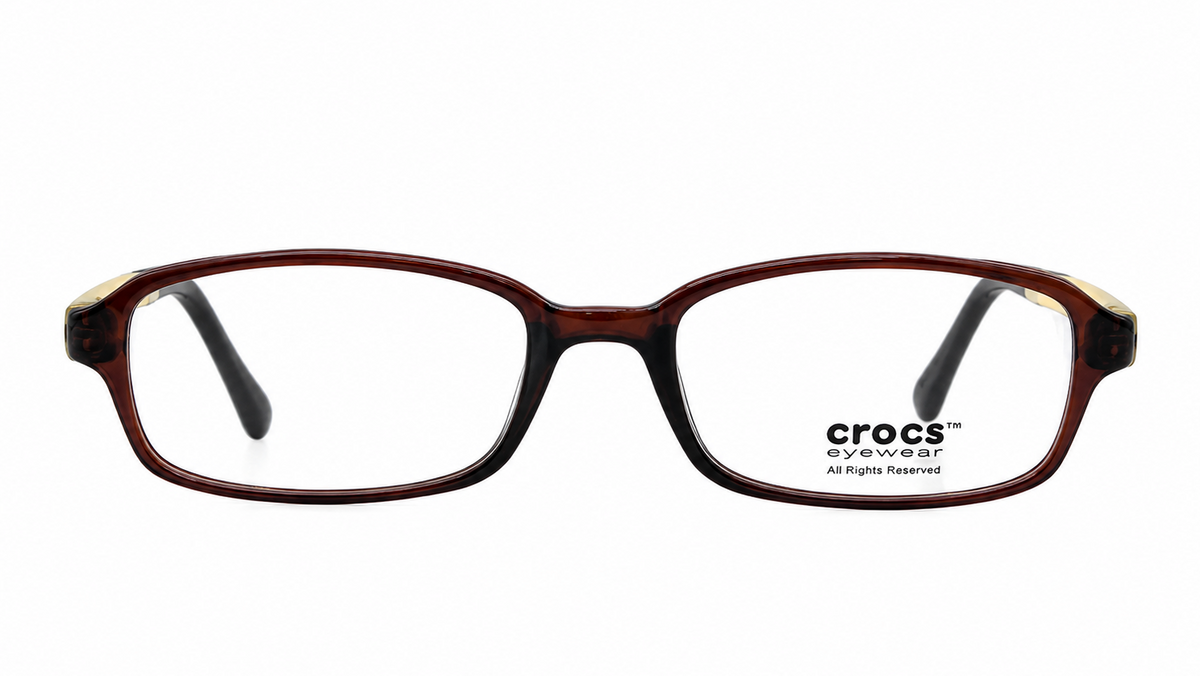 Crocs eyeglasses in a dark brown and black tortoiseshell acetate frame, featuring clear lenses with the Crocs logo printed on the lower right lens.