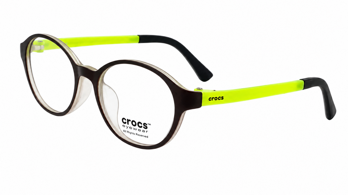 Crocs round eyeglasses with a dark brown acetate frame, clear lenses, and bright neon yellow-green temples with black tips.