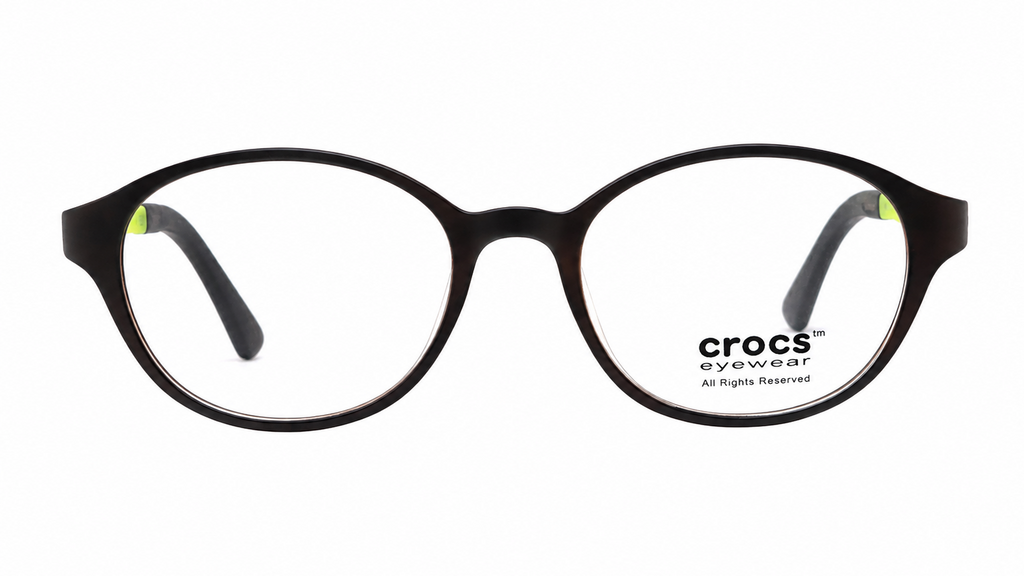 Crocs eyewear round black acetate frames with clear lenses and small lime green temple tips, shown on a white background.