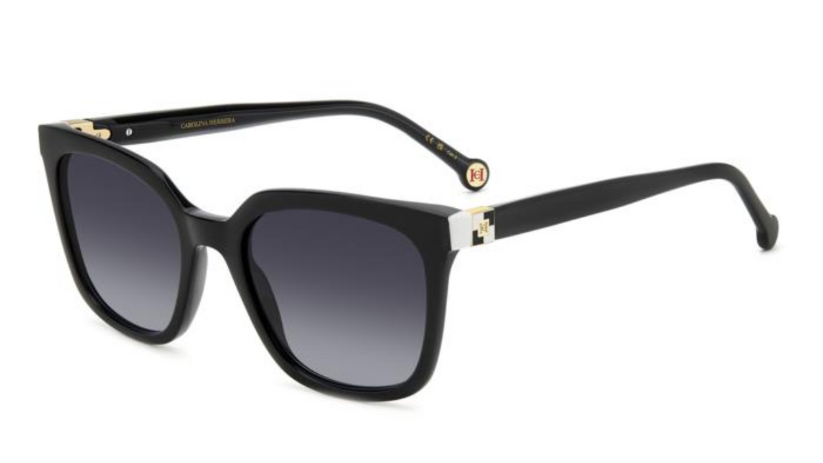 A pair of designer sunglasses with a black acetate frame, gradient gray lenses, and gold-tone metal accents on the temples, shown on a plain white background.