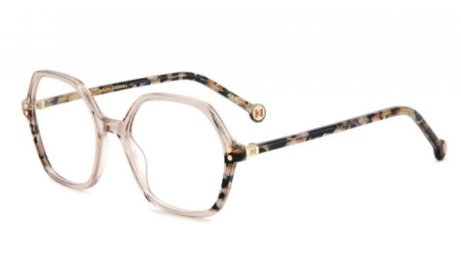 A pair of eyeglasses featuring a translucent pale pinkish-tinted square frame with tortoiseshell-patterned temples in brown, black, and beige, accented with gold metal hardware.