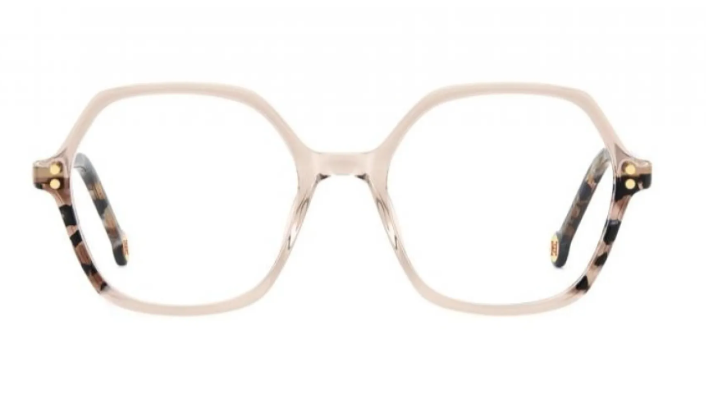 Oversized square eyeglasses with a translucent pale blush pink frame and tortoiseshell-patterned temples with gold-tone rivets, shown against a plain white background.