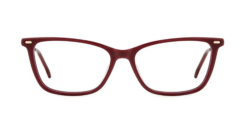 A pair of eyeglasses with a thick, rounded cat-eye frame in a translucent burgundy red acetate, featuring small gold metal accents on the hinges and clear lenses, shown against a plain white background.