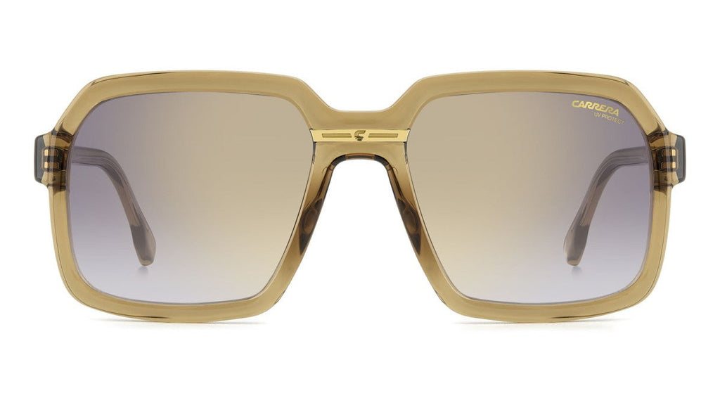  square sunglasses with a translucent gold acetate frame and gradient brown lenses, shown against a plain white background.