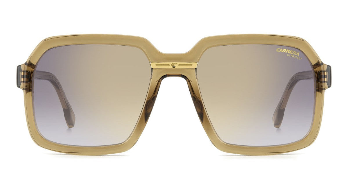  square sunglasses with a translucent gold acetate frame and gradient brown lenses, shown against a plain white background.