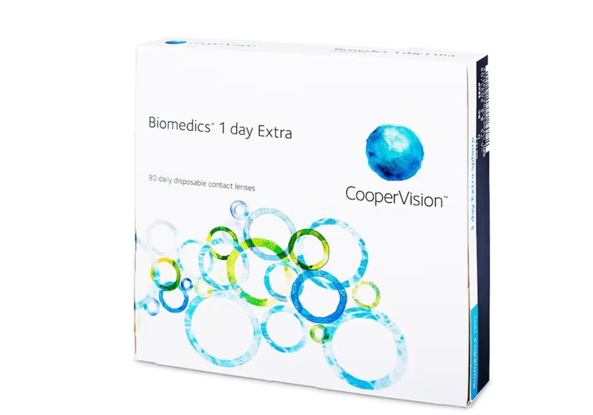 CooperVision Biomedics 1 day Extra contact lens box, featuring a white packaging design with blue and green circular graphics and the brand name CooperVision.