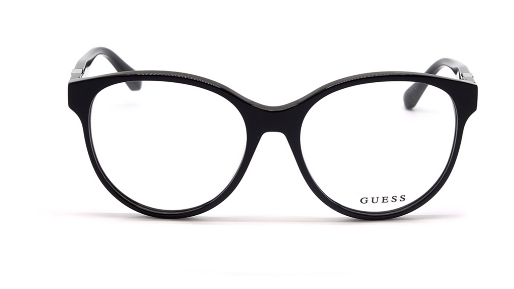 GUESS eyeglasses in black with a thick, rounded cat-eye frame and clear lenses, shown against a plain white background.