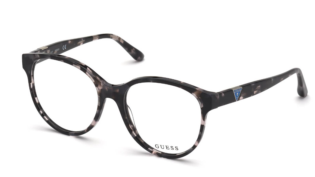 GUESS eyeglasses in a dark brown and black tortoiseshell acetate, featuring a thick round frame and clear lenses, shown on a white background.