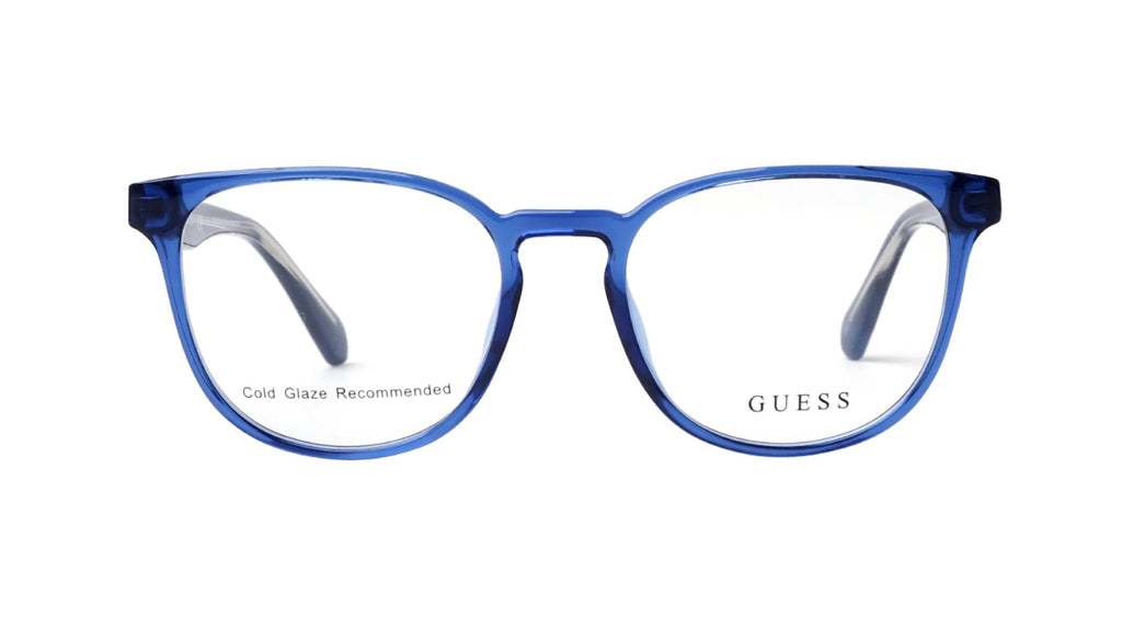 Blue translucent acetate round eyeglasses frames with clear lenses, featuring the GUESS brand name on the lower right lens.