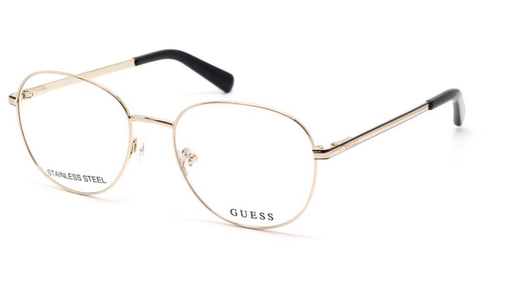 GUESS aviator-style eyeglasses in gold-toned metal with clear lenses and black temple tips, shown on a white background.