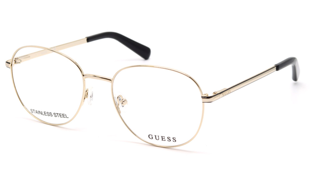 GUESS aviator-style eyeglasses in gold-toned metal with clear lenses and black temple tips, shown on a white background.