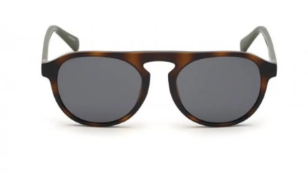 A pair of round sunglasses with a dark brown tortoiseshell acetate frame, dark gray lenses, and light gray temples, shown against a plain white background.