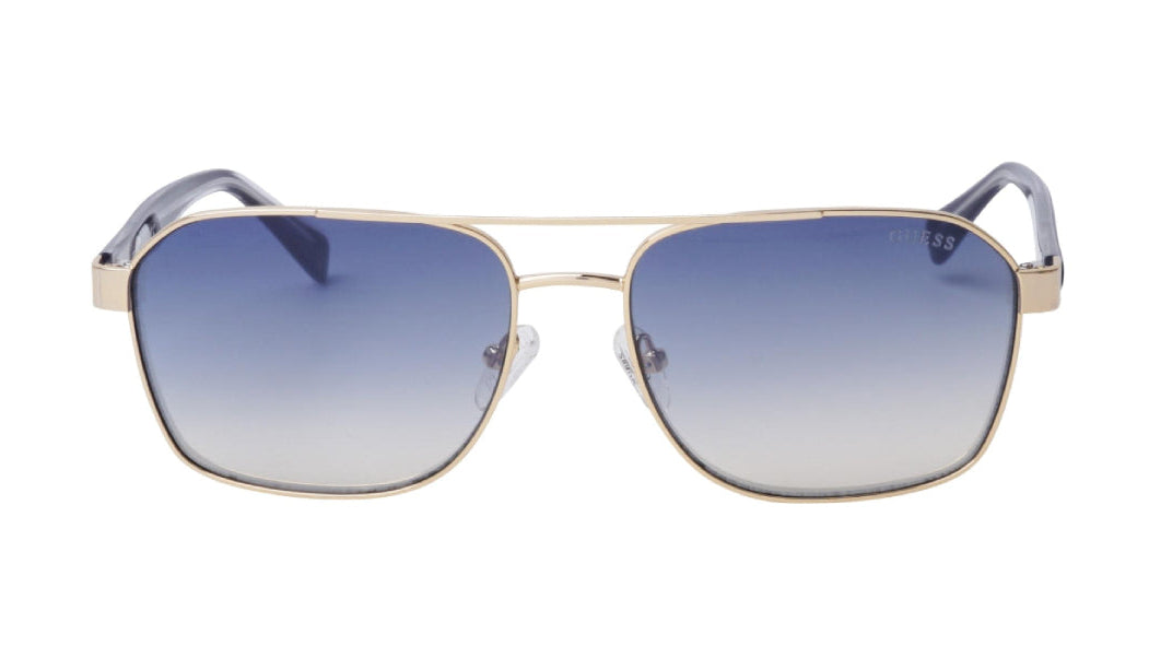 A pair of aviator-style sunglasses with a gold metal frame and gradient blue-to-clear lenses, shown against a plain white background.