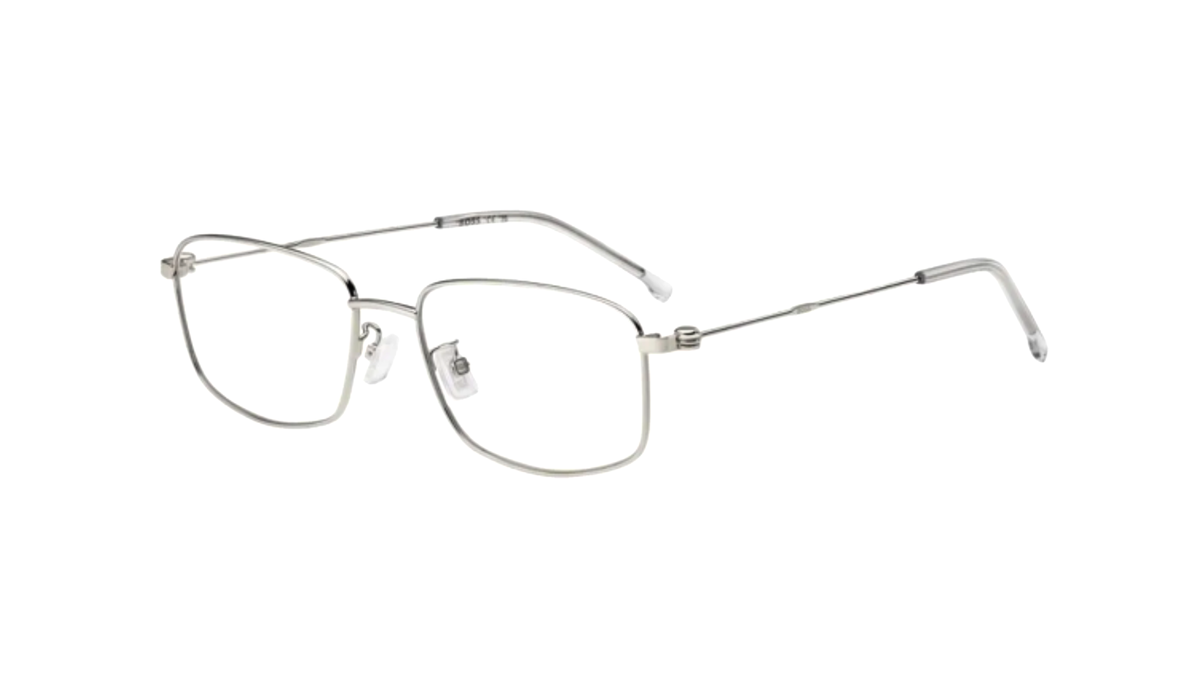 A pair of slim metal eyeglasses with a silver-tone frame and clear lenses, shown from a three-quarters angle on a plain white background.
