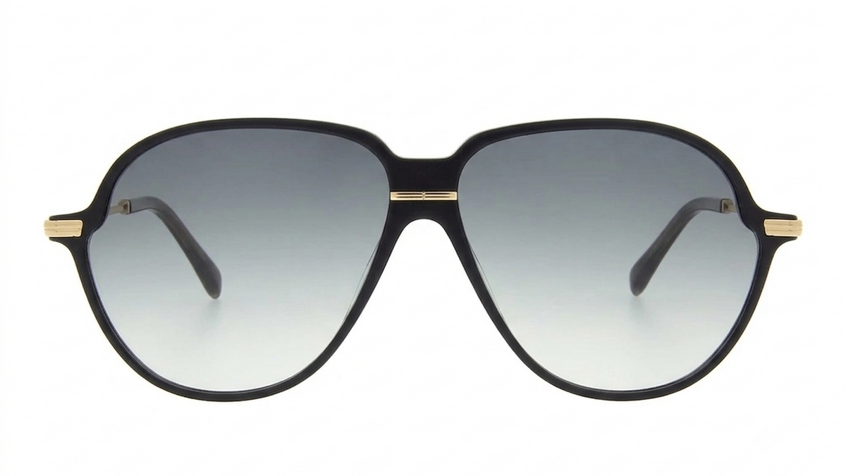 A pair of oversized aviator-style sunglasses with a thick black frame, gradient gray lenses, and gold metal accents on the bridge and temples, shown against a plain white background.