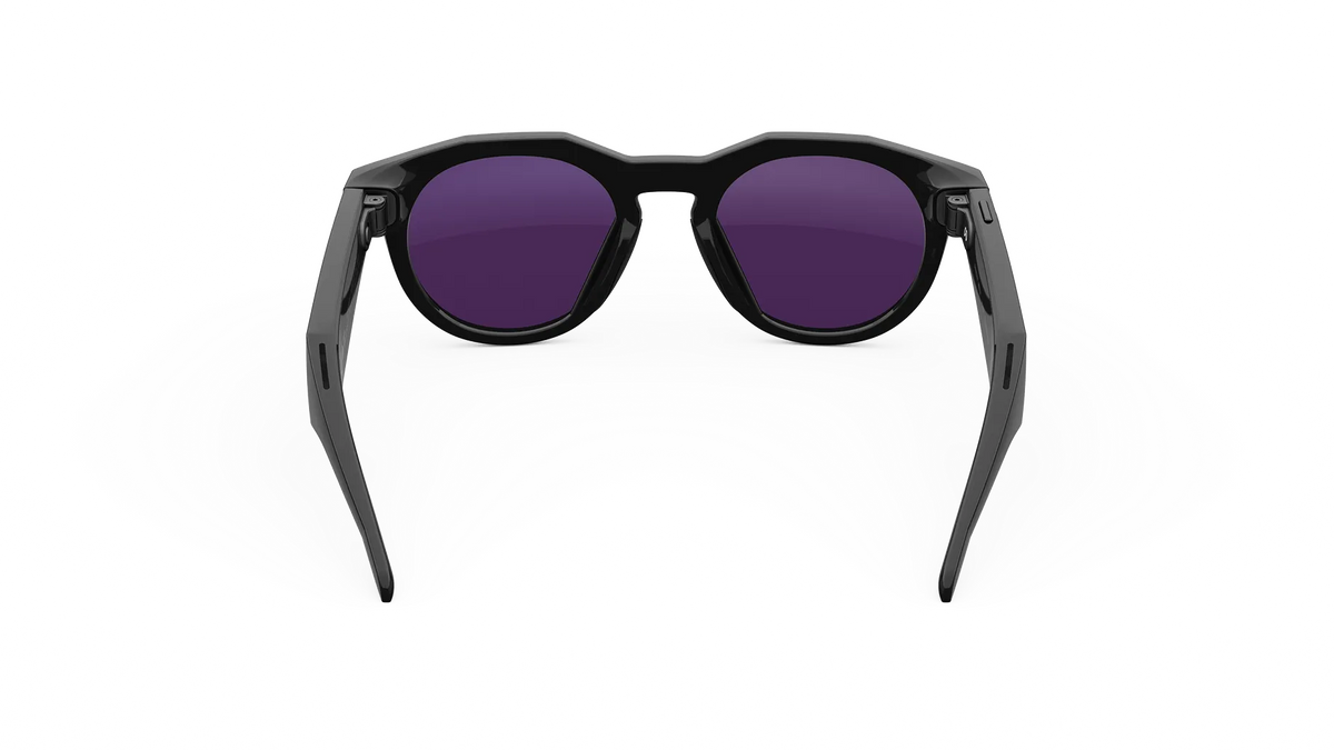 Black sunglasses with purple lenses on a white background