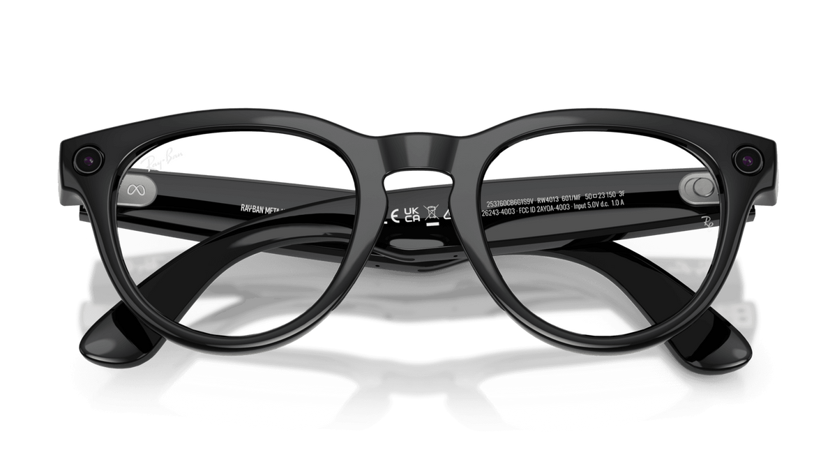Ray-Ban | Meta Headliner Shiny Black -Transitions Gen 2  Black eyeglasses on a reflective surface with a dark background