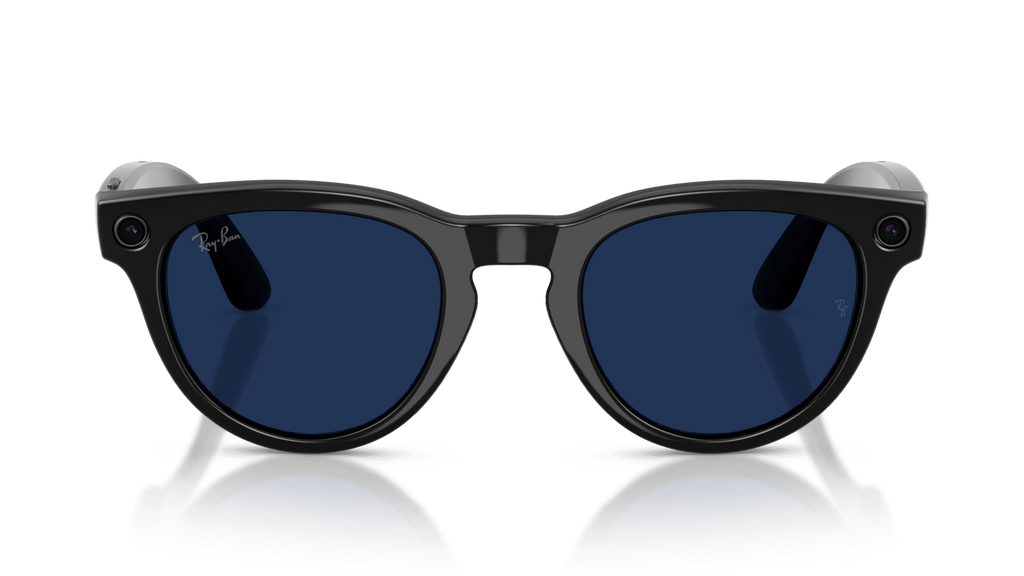 Ray-Ban | Meta Headliner Shiny Black -Transitions Gen 2  Black sunglasses with blue lenses on a clear stand against a dark background