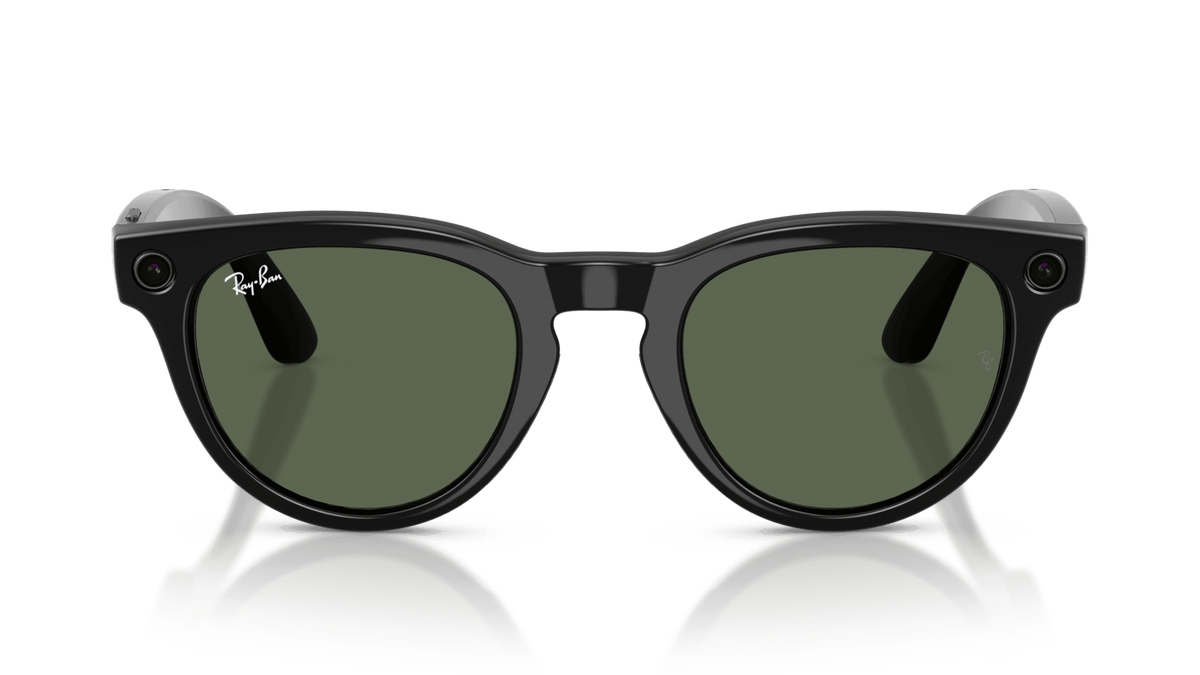 Ray-Ban Meta Headliner Shiny Black - Gen 2  Black sunglasses with green lenses on a clear stand against a clear background
