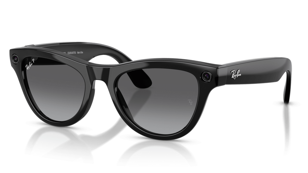 Ray-Ban | Meta Skyler Shiny Black - Gen 2  Black sunglasses on a reflective surface with a clear background