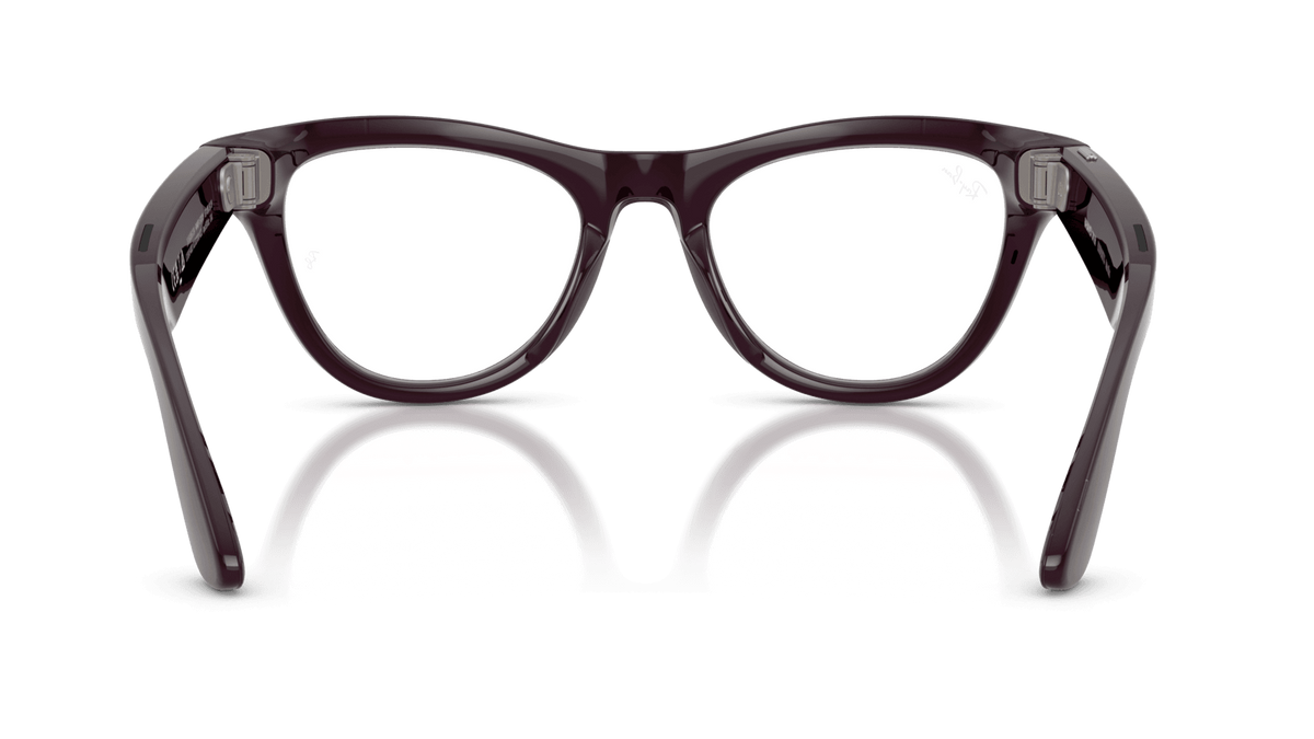 Ray-Ban | Meta Skyler Shiny Mystic Violet -Transitions Gen 2Black eyeglasses on a reflective surface with a dark green background