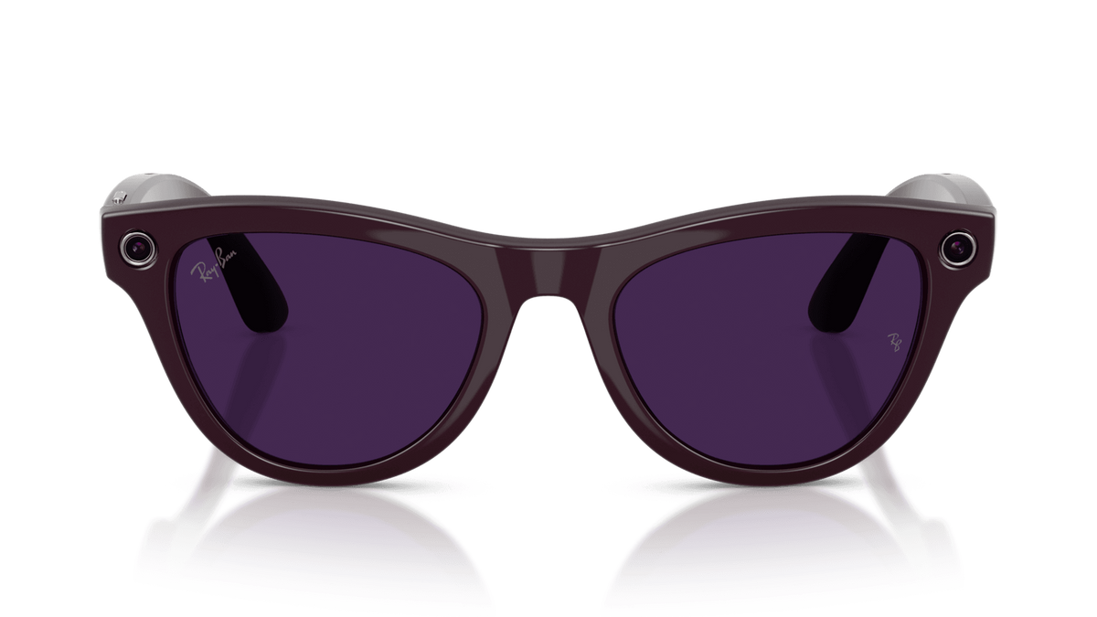Ray-Ban | Meta Skyler Shiny Mystic Violet -Transitions Gen 2 Sunglasses with purple lenses on a reflective surface against a gradient background