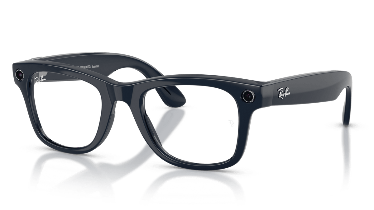 Ray-Ban | Meta Wayfarer Shiny Cosmic Blue -Transitions Gen 2Black framed glasses with clear lenses on a reflective surface