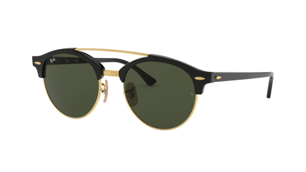 Ray-Ban Clubmaster round sunglasses with black acetate frames, gold metal rims and bridge, and dark green lenses, shown on a plain white background.
