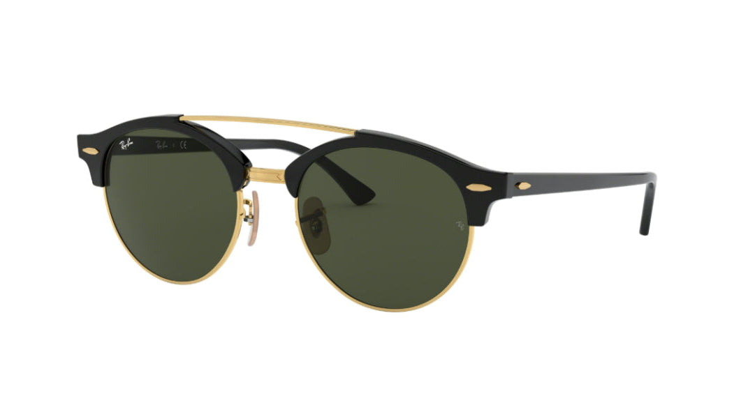 Ray-Ban Clubmaster round sunglasses with black acetate frames, gold metal rims and bridge, and dark green lenses, shown on a plain white background.