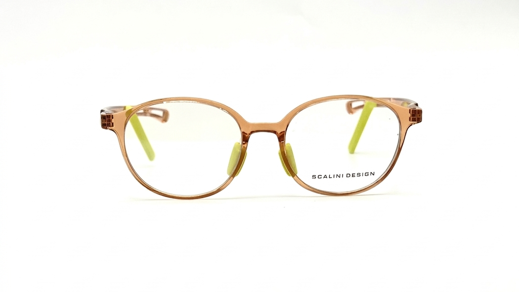 Oval eyeglasses with a translucent brown acetate frame, clear lenses, and lime green nose pads, shown against a plain white background. The brand name 'SCALINI DESIGN' is printed on the lower right frame rim.