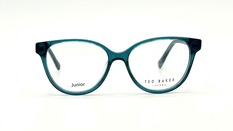 A pair of Ted Baker Junior eyeglasses with a translucent teal blue acetate frame, shown against a plain white background.