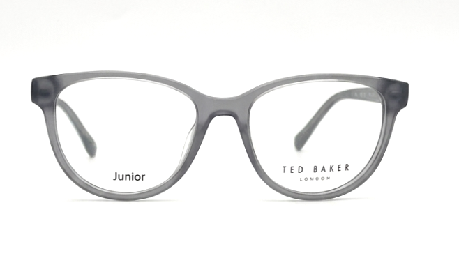 A pair of Ted Baker London Junior eyeglasses in a translucent smoky gray acetate, featuring a classic rounded cat-eye frame shape with clear lenses.