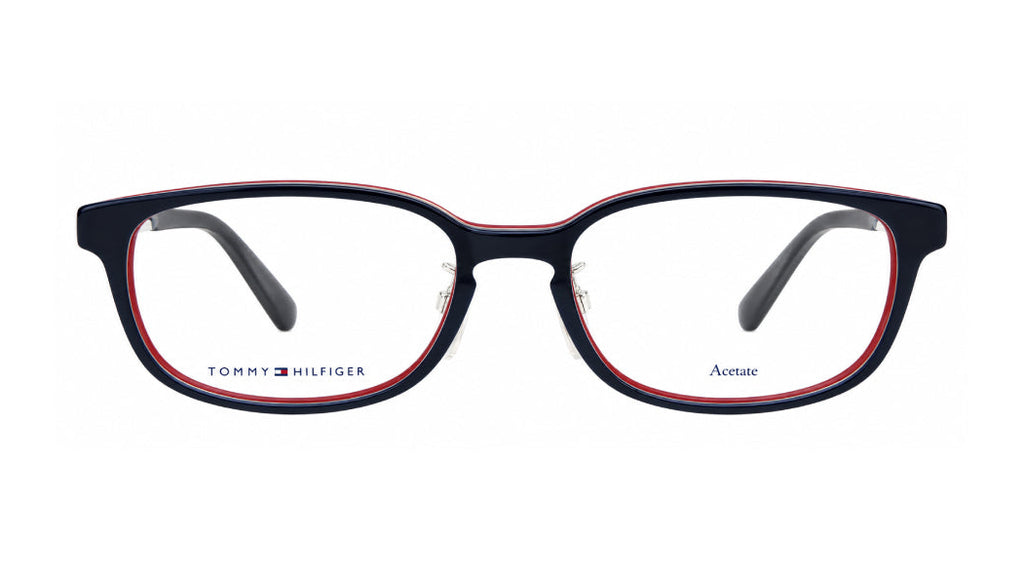Tommy Hilfiger acetate eyeglasses with a navy blue front, red inner border, and clear lenses, shown against a plain white background.