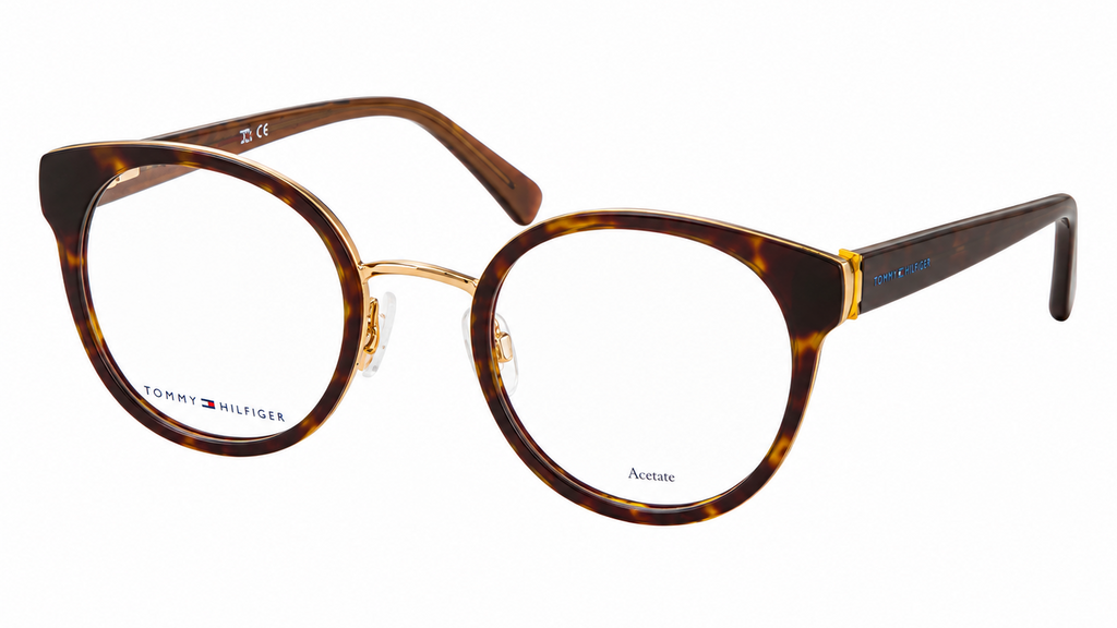 Tommy Hilfiger Aviator eyeglasses featuring a brown tortoiseshell acetate frame with gold metal rims and temples, shown on a plain white background.