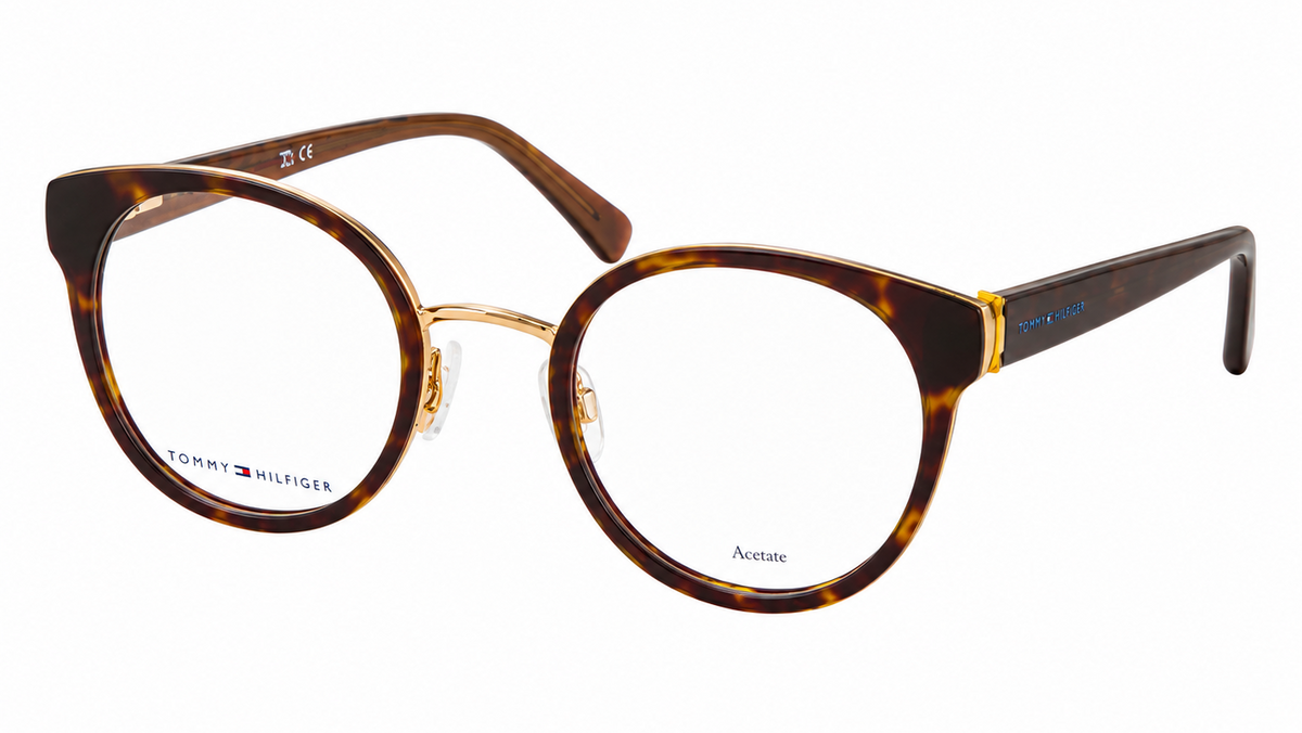 Tommy Hilfiger Aviator eyeglasses featuring a brown tortoiseshell acetate frame with gold metal rims and temples, shown on a plain white background.