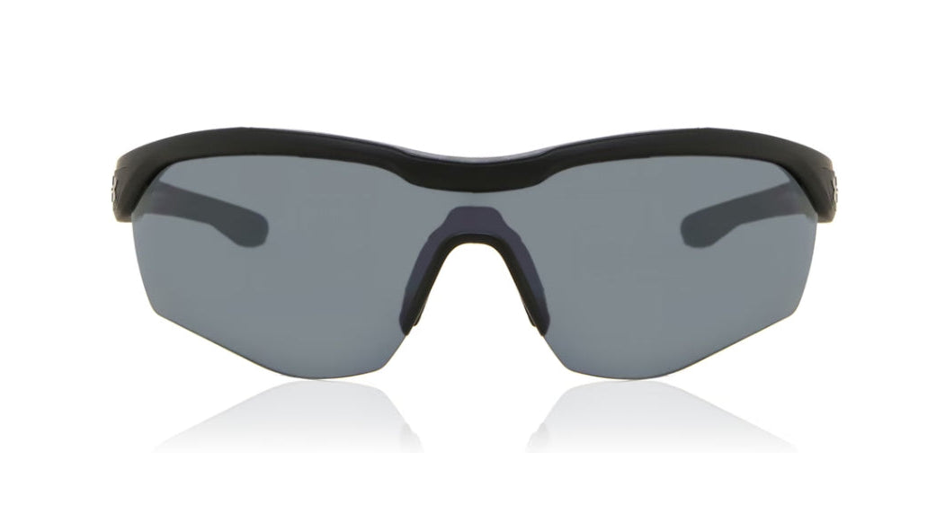 Wraparound shield-style sunglasses with a matte black frame and dark gray tinted lenses, shown on a clean white background with a faint reflection below.
