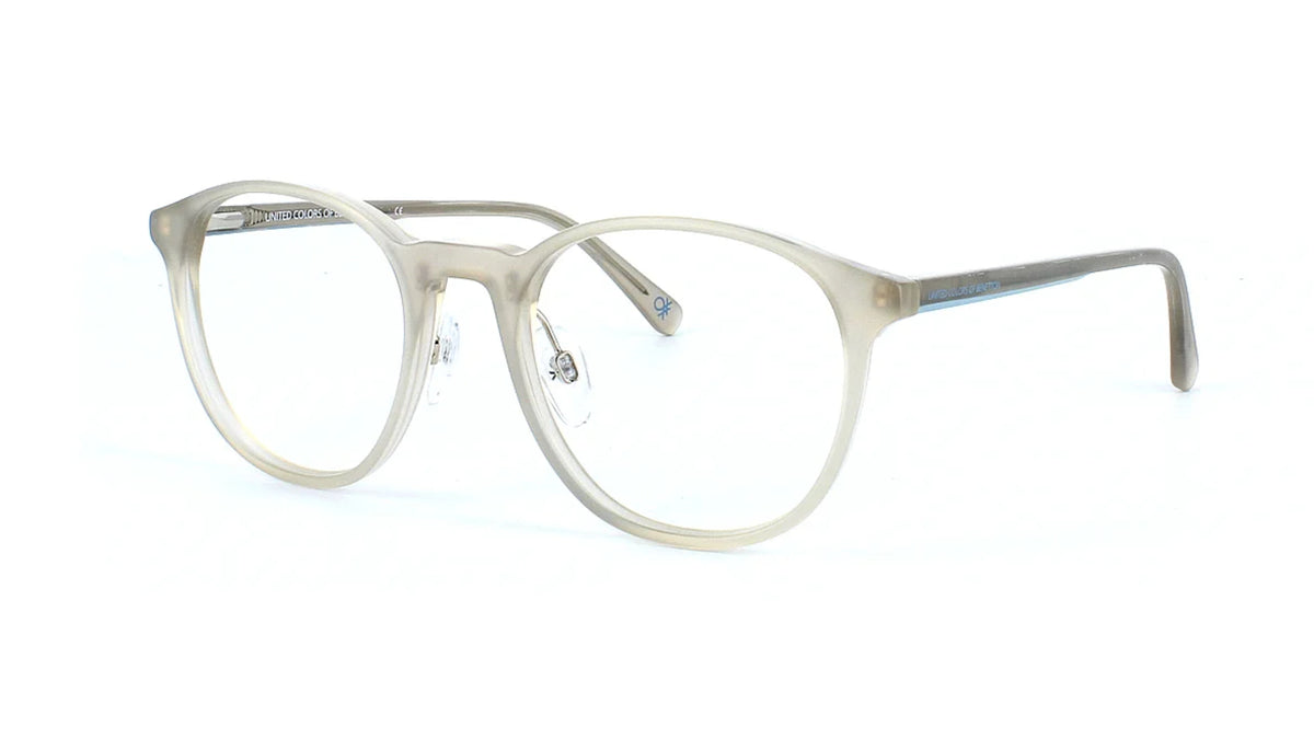 A pair of semi-transparent light beige acetate eyeglass frames with clear lenses, displayed on a clean white background.