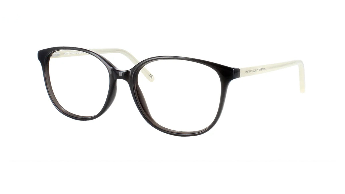 Oversized round eyeglasses with a glossy black front and translucent white temples, shown on a plain white background.