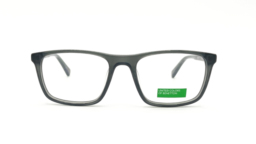 A pair of square-frame eyeglasses with a translucent dark gray acetate frame and clear lenses, shown against a plain white background. A small green sticker on the lower right lens reads 'UNITED COLORS OF PENNSYLVANIA'.